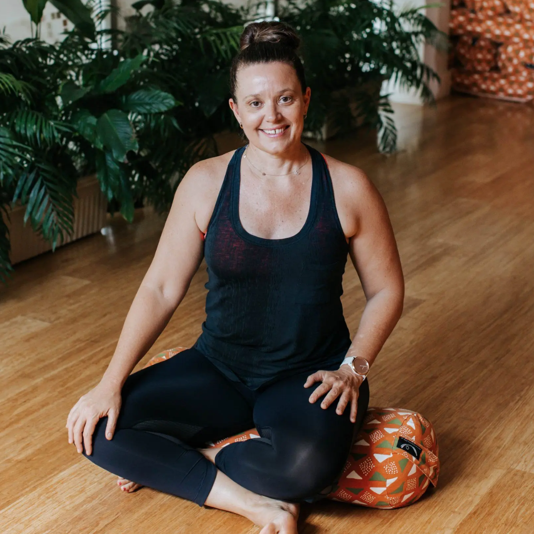 a yoga practitioner sitting for a photo