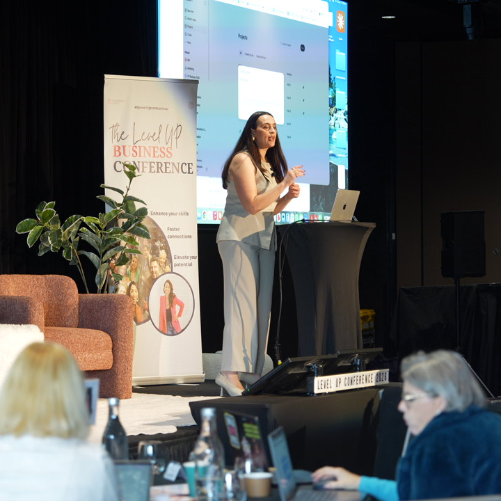 Woman speaking at a business conference.